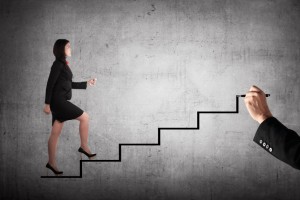 climbing stairs staircase to Biglaw partner partnership woman lawyer