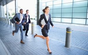 woman lawyer female attorney running ahead of men