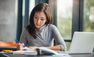 Asian American woman studying student