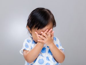 Toddler with hands over face face palm, d’oh, sad, embarrass, diverse, stress