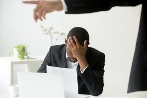 Frustrated hopeless african-american office worker getting fired from job concept