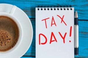 The inscription Tax Day on the note like Notification of the need to file tax returns, tax form