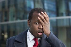 face palm diverse Close up portrait of african american businessman with face palm gesture. Disappointed stressed out black business man making facepalm with hand.