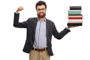 Happy teacher flexing his biceps and holding stack of books