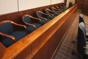 Empty seats in the jurors row in the court room