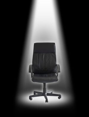 Office chair under spotlight