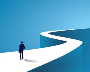 Business journey, businessman walking on long winding path going to success in the future long road
