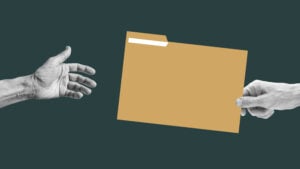 Human hand passing the folder
