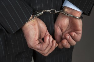 handcuff handcuffs businessman crime white collar criminal