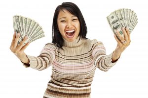Excited Young Woman Holding Money