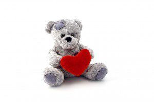 teddy-bear-toy-holding-a-heart-on-white-background-300x200