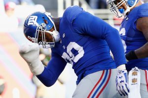 Adam Schefter knows what's under Jason Pierre-Paul's taped up mitt. (Photo by Michael Reaves/Getty Images)