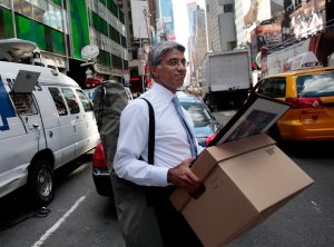 An employee of Lehman Brothers carries a box out of the company's headquarters building September 15, 2008 in New York City. (Photo by Chris Hondros/Getty Images)