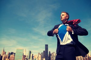 Superhero Businessman Standing Outdoors Over City Skyline