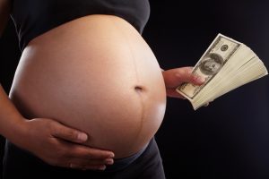 pregnant woman pregnancy cash money paid surrogacy surrogate