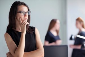 young woman lawyer thinking deciding decision thoughtful