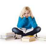 sad law school dropout fail Schoolgirl sitting tired, frustrated on floor learning with study books