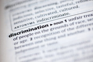 Close up to the dictionary definition of word Discrimination