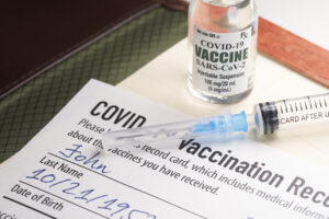 Biglaw Firms Continue To Roll Out Vaccine Mandates, Delay Reopenings