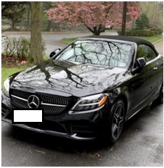 Photo of black mercedes parked in a driveway