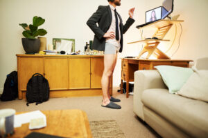 Businessman in unseen underpants video calling colleagues from home