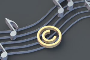 Golden copyright symbol near silver notes. Intellectual property concept. Copyright of the music or song. 3d render