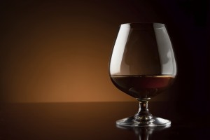 Glass of luxury cognac with copy space