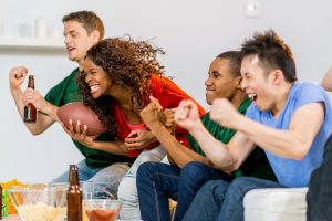 Young adults watching football