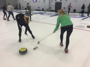 Allison Peryea and Andrea learning how to 'sweep.'