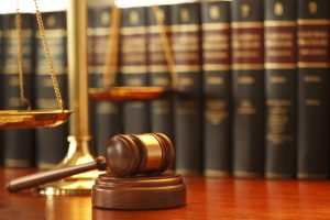 Gavel And Scales Of Justice On Desk In Law Office