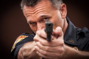 Police Officer Pointing Handgun