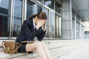 sad lawyer litigator in front of building