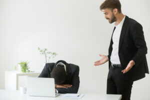 Angry mean caucasian boss shouting scolding frustrated african american employee