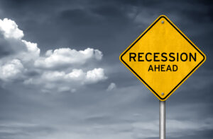 Recession ahead – road sign warning concept