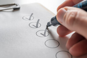 Check off a to-do list with a black pen