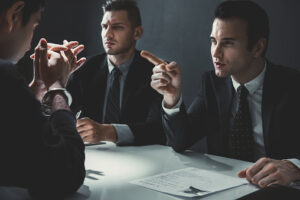 Criminal man being interviewed in interrogation room