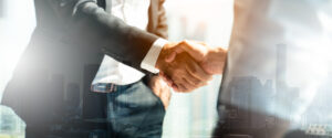 Businessman handshake for teamwork of business merger and acquis