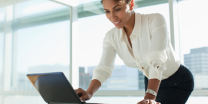Businesswoman_working_on_laptop_in_office copy