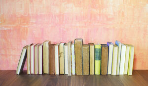 row of old books on grungy background