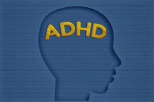 paper head with ADHA text