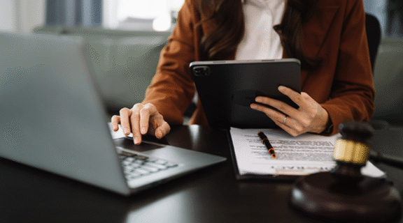 Woman working on computer, law school rankings